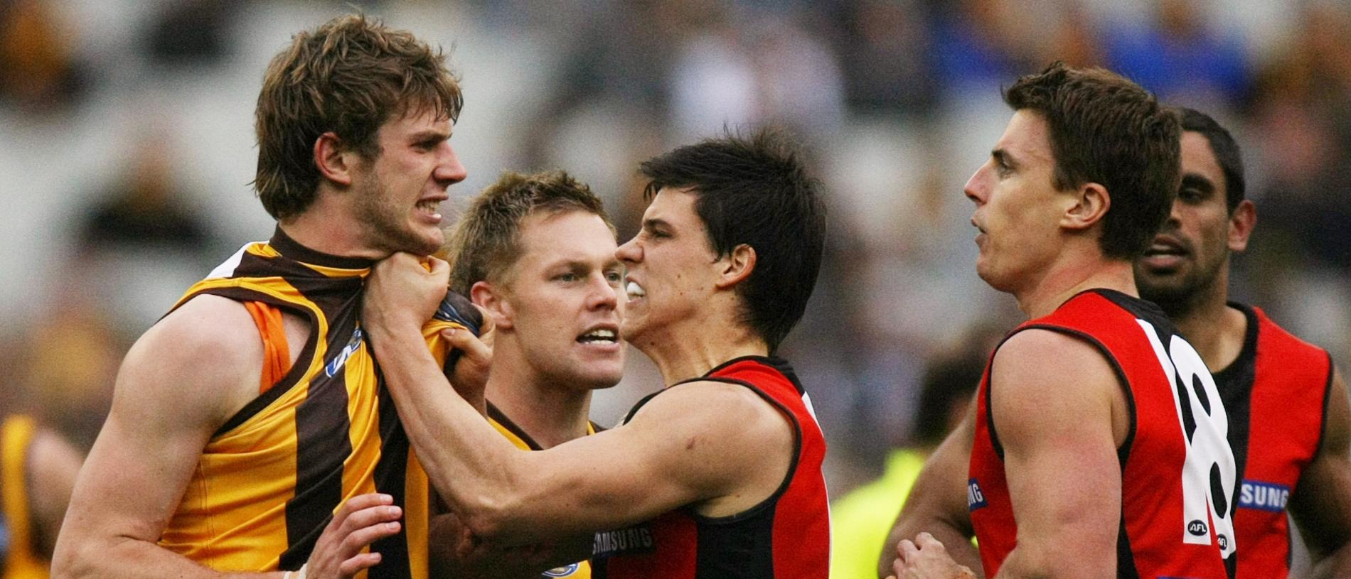 Grant Birchall and Sam Mitchell remonstrate with Matthew Lloyd after a collision involving Brad Sewell, as Angus Monfries stands in the way.