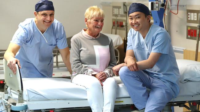 Dale Murdoch, left, with patient Nadeane Giles and fellow cardiologist Karl Poon at the Prince Charles Hospital. Picture: Lyndon Mechielsen