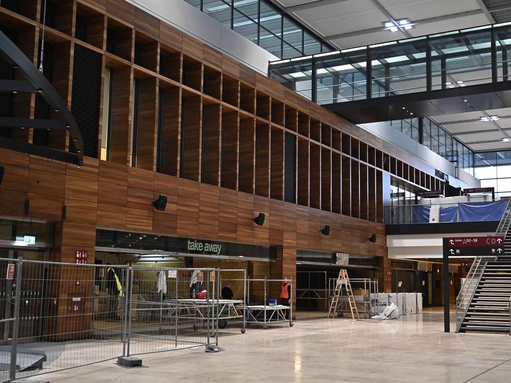 Workers put the finishing touches on the terminal. Picture: Tobias Schwarz/AFP