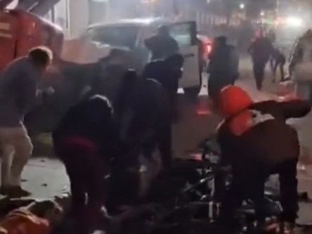 Bystanders trying to help victims on Bourbon Street in New Orleans. Picture: Raws Alerts/X