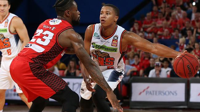 PERTH, AUSTRALIA — DECEMBER 09: Devon Hall of the Taipans passes the ball during the round eight NBL match between the Perth Wildcats and the Cairns Taipans at RAC Arena on December 09, 2018 in Perth, Australia. (Photo by Paul Kane/Getty Images)