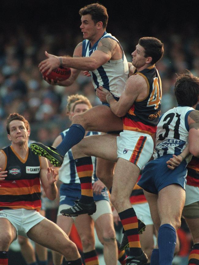 Wayne Carey marks in front of Peter Caven. Caven was anxious about playing on The King