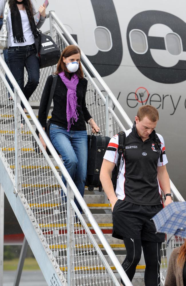 A passenger wearing a face mask to protect against swine flu.