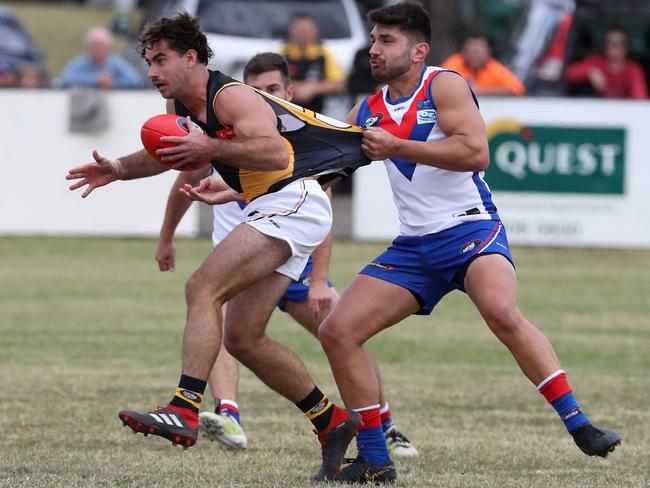 Jack Blair is caught in a tackle. Picture: Mark Dadswell