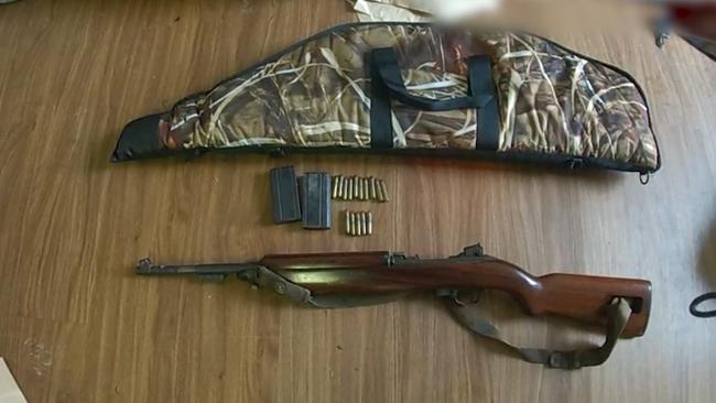 What appears to be an M1 carbine semiautomatic rife was among the large cache of firearms. Picture: QPS