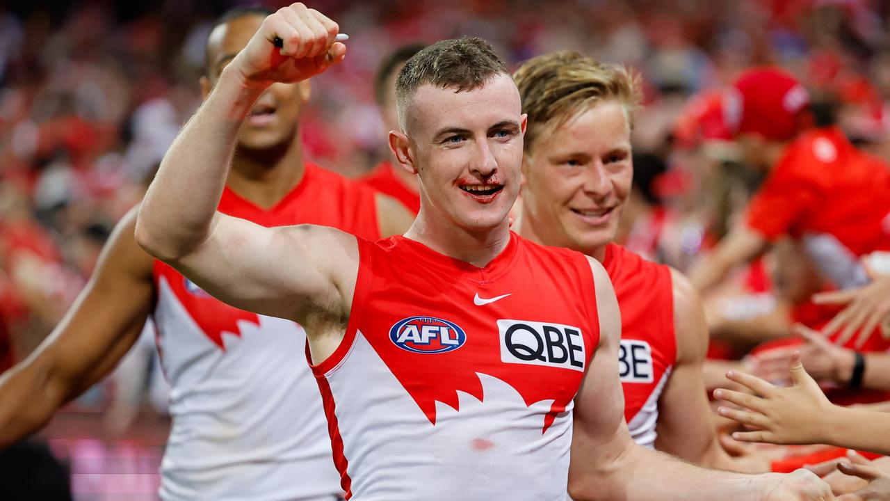 SYDNEY, AUSTRALIA - SEPTEMBER 07: Chad Warner of the Swans celebrates with fans during the 2024 AFL First Qualifying Final match between the Sydney Swans and the GWS GIANTS at The Sydney Cricket Ground on September 07, 2024 in Sydney, Australia. (Photo by Dylan Burns/AFL Photos via Getty Images)