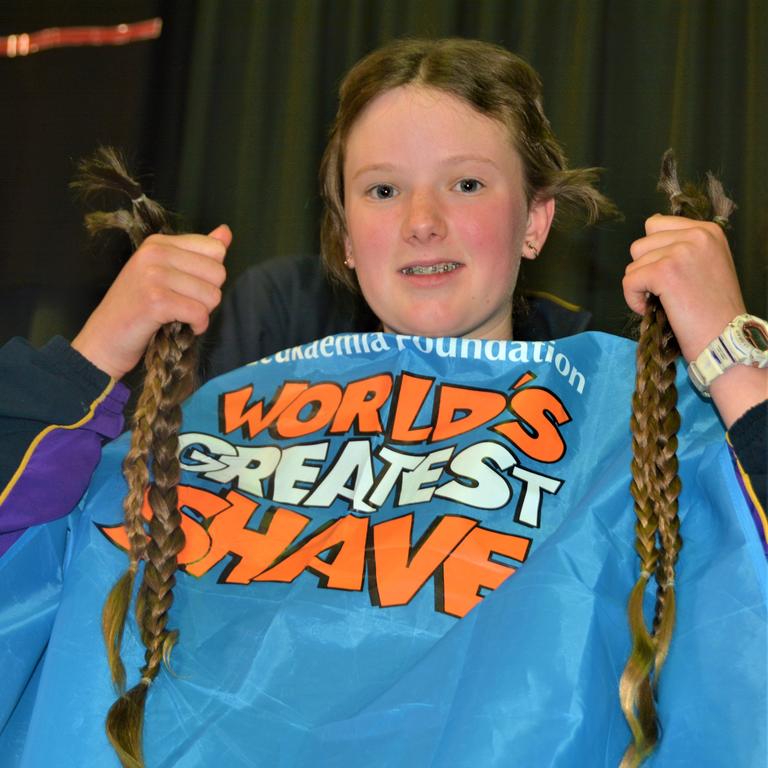 At the St Joseph's College 2023 World's Greatest Shave event is Meghan Ellis getting her cut by hairdresser Caitlin Symes from the Hair Room on Russell. Picture: Rhylea Millar