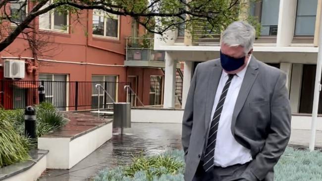 Carl Robert Trevenar hid his face with a mask as he left Wollongong Local Court on October 12.