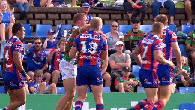 George Burgess elbows Mitch Barnett during the Knights v Rabbitohs match.