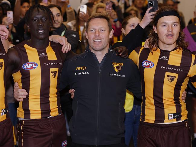 Sam Mitchell, senior coach of Hawthorn joins in the song after beating the Crows. Picture: Michael Klein