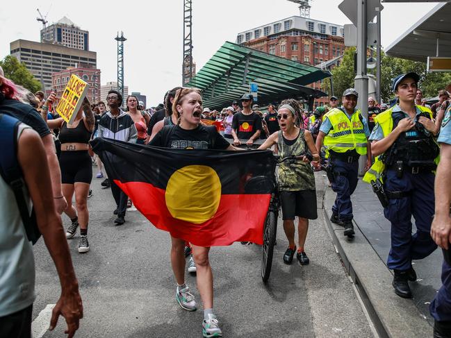 Demonstrators shout slogans as they march towards Victoria Park during an Invasion Day protest. Picture: Getty Images