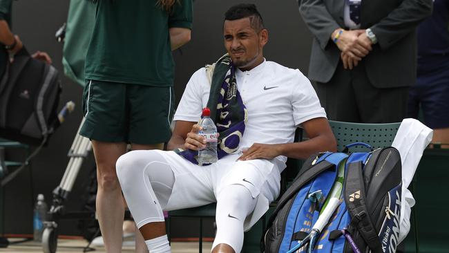 Australia's Nick Kyrgios grimaces during a break in play against France's Pierre-Hugues Herbert.