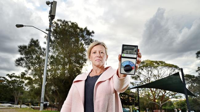 Vivian Dunstan holds an electromagnetic wave detector at Tania Park, Balgowlah. Residents are concerned about the possible dangers of 5G. Picture: Troy Snook