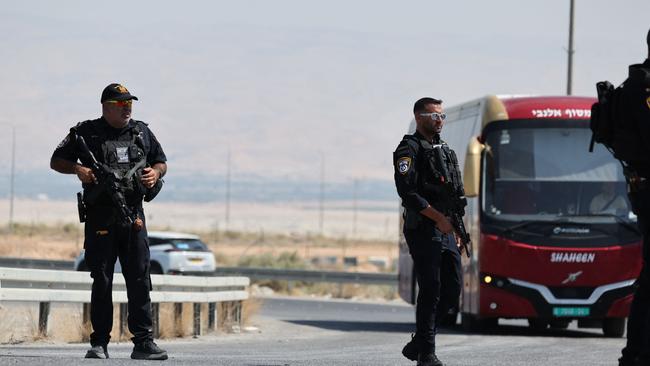 Israeli security forces gather at the scene of the attack near the Allenby Crossing. Picture: AFP.