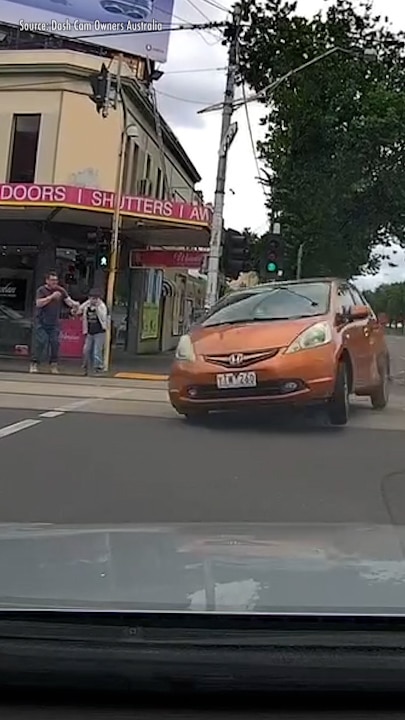 Red light smash narrowly misses pedestrians