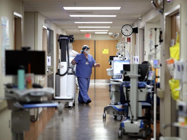 Radiologists prepare to take an X-ray image in a COVID-19 patient's room in the intensive care unit of MedStar St. Mary's Hospital in Leonardtown, Maryland. Picture: AFP