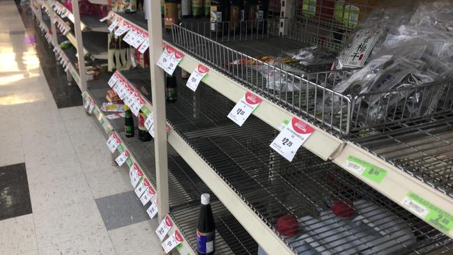 Empty shelves inside the store, which is set to close before the end of the financial year.