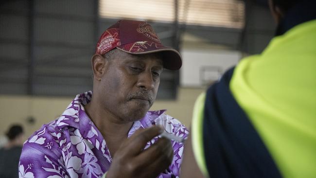 George Morseau administers the AstraZeneca vaccine at the Boigu community centre. Vaccinations started ahead of schedule in the Torres Strait, with health authorities bringing forward the coronavirus vaccine rollout amid growing concerns of an outbreak in the remote region as nearby Papua New Guinea grapples with a COVID-19 epidemic. Picture: Getty