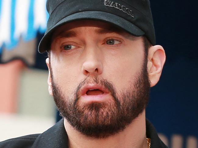 (FILES) In this file photo taken on January 30, 2020 Eminem speaks during a ceremony honoring 50 Cent with a star on the Hollywood Walk of Fame in Hollywood, California. - Music's A-listers will celebrate a new crop of legends entering the Rock and Roll Hall of Fame this weekend, among them country queen Dolly Parton and rap agitator Eminem. (Photo by Leon Bennett / GETTY IMAGES NORTH AMERICA / AFP)