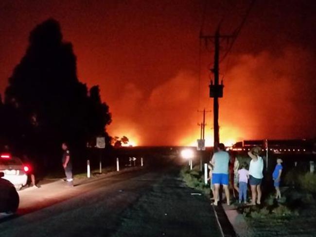 Terang residents look on as the power station fire rages. Picture: Facebook