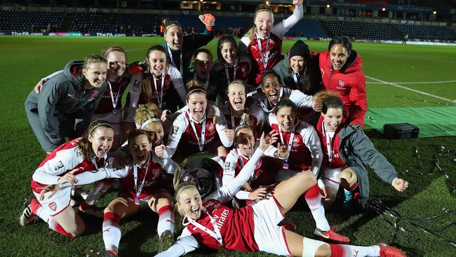 The Arsenal squad celebrate after winning the WSL Continental Cup over Manchester City.