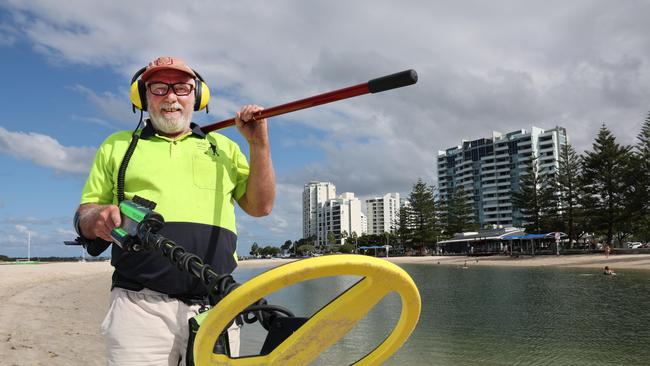 Mick Egan is a Gold Coast metal detector who helps reunite people with their sentimental items and valuables. Mick working at Harley Park Labrador. Picture Glenn Hampson