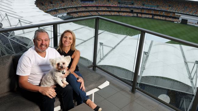 Anna Perfetto and Robert Felesian on their apartment balcony overlooking the Gabba, Kangaroo Point. Picture: Liam Kidston