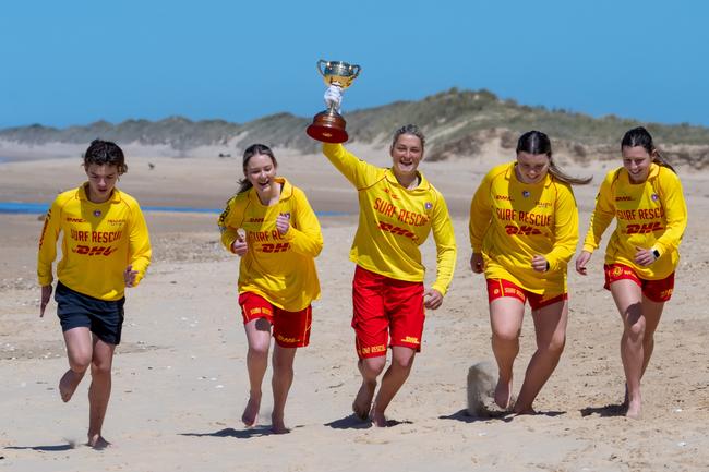 Seaspray surf lifesavers take the Cup for a run. Picture: Jay Town