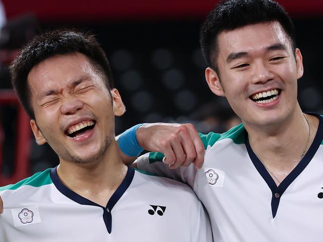 CHOFU, JAPAN - JULY 31:  Lee Yang and Wang Chi-Lin of Team Chinese Taipei celebrate as they win against Li Jun Hui and Liu Yu Chen of Team China during the Men's Doubles Gold Medal match on day eight of the Tokyo 2020 Olympic Games at Musashino Forest Sport Plaza on July 31, 2021 in Chofu, Tokyo, Japan.  (Photo by Lintao Zhang/Getty Images)