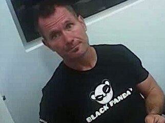 Body-worn footage of Baxter sitting in a shopping centre police beat office where he refused to be interviewed after being asked about being wanted for breaching a domestic violence order.