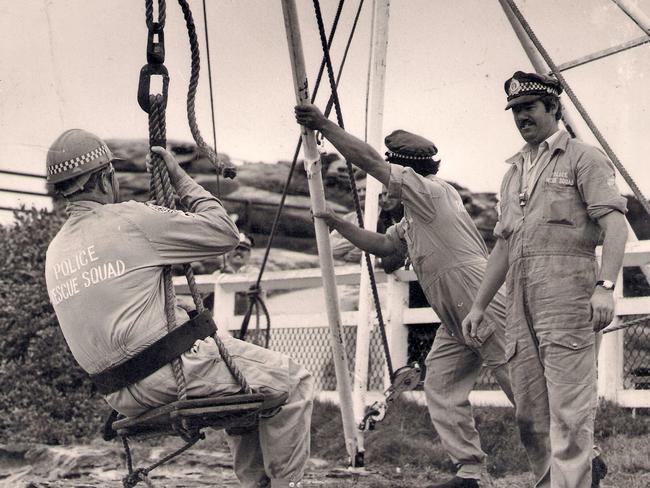 1978: New South Wales police rescue officers train with a cliff rescue device near The Gap, Sydney. File picture