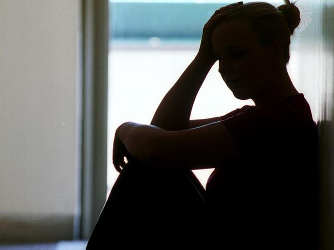 21 Dec 2001 Silhouette of young woman seated in doorway, date rape victim in Adelaide. Sexual Assault crime sa sex generic