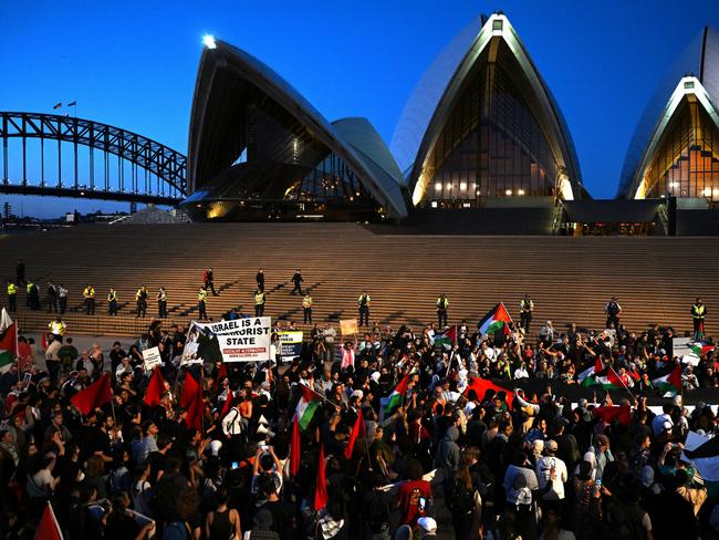 Participants of a Free Palestine rally react outside Sydney Opera House in Sydney on Monday. Picture: AAP Image