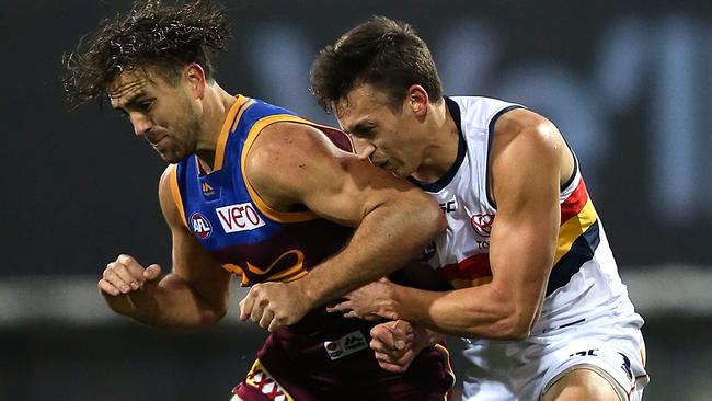 Rhys Mathieson collides with Tom Doedee.