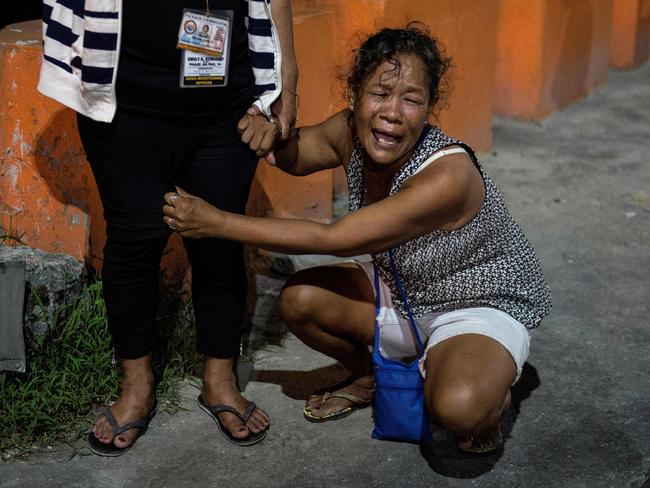 Maria Espinosa crying outside the funeral parlour where the body of her dead 16-year-old son, Sonny Espinosa, was taken in Manila. Picture: AFP Photo/Noel Celis