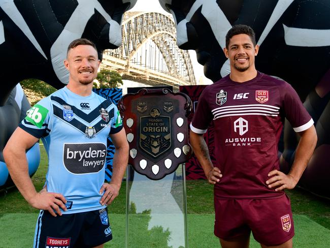 NSW Blues player Damien Cook (left) and  Queensland Maroons player Dane Gagai pose for a photograph with the State of Origin Shield during the 2019 Holden State of Origin Series Launch at Milsons Park in Sydney, Wednesday, May 15, 2019. The opening game of the series will be played at Suncorp Stadium on June 5. (AAP Image/Bianca De Marchi) NO ARCHIVING