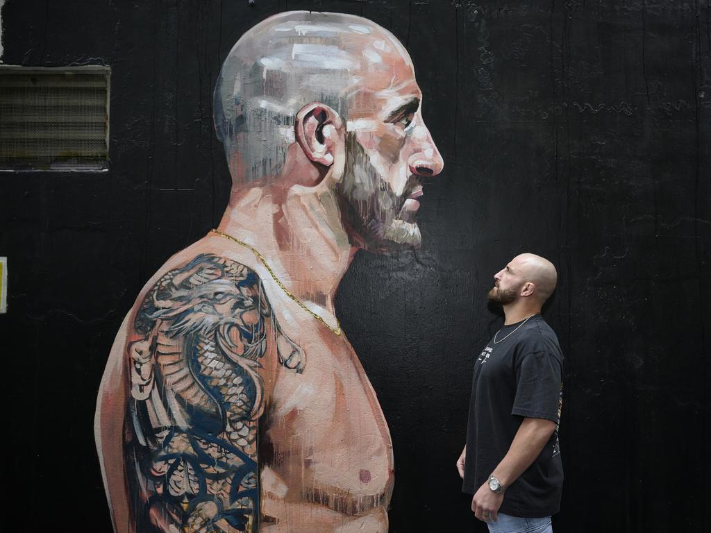 UFC featherweight champion, Alex Volkanovski in front of his mural. Picture: Brett Hemmings (Zuffa LLC)