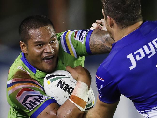 Canberra's Joeseph Leilua attacks Bulldogs Josh Morris during NRL match Canterbury Bulldogs v Canberra Raiders at Belmore Sports Ground. Picture. Phil Hillyard