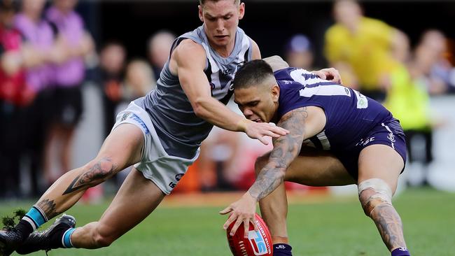 Kane Farrell of the Power and Michael Walters of the Dockers contest the ball during the Optus Stadium clash. Picture: Getty Images