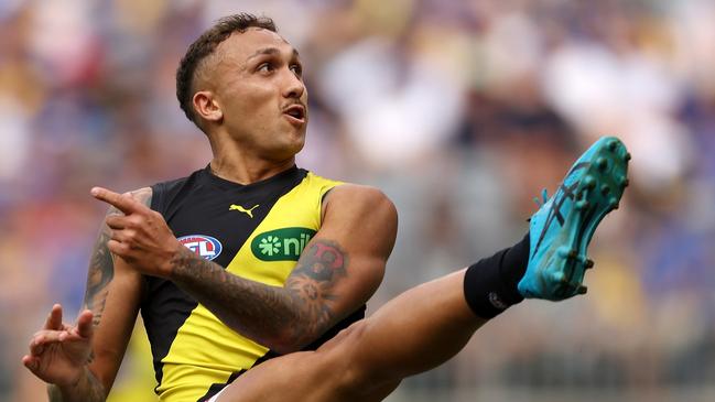 PERTH, AUSTRALIA - APRIL 14: Shai Bolton of the Tigers kicks on goal during the 2024 AFL Round 05 match between the West Coast Eagles and the Richmond Tigers at Optus Stadium on April 14, 2024 in Perth, Australia. (Photo by Will Russell/AFL Photos via Getty Images)