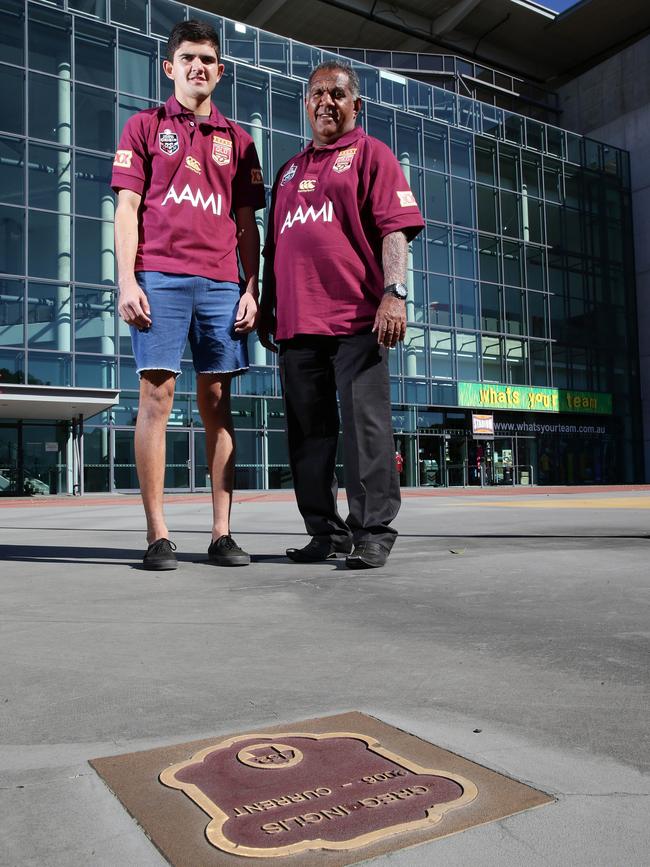 Jake and Adrian Coolwell with the Greg Inglis plaque at Suncorp Stadium. Picture: Liam Kidston.