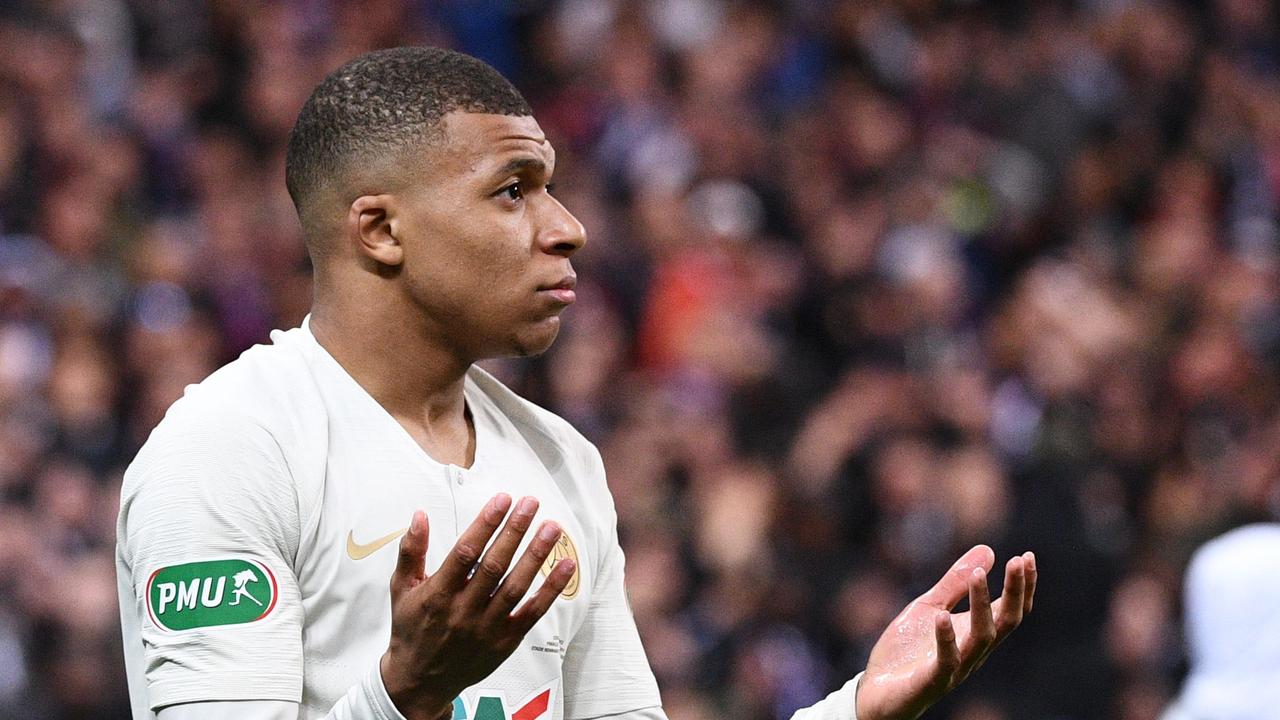 Paris Saint-Germain's French forward Kylian Mbappe leaves the pitch after receiving a red card