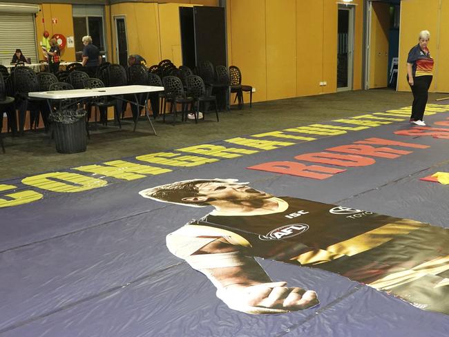 The Crows supporters group makes the banner for Rory Sloane’s 200th game which they don’t know when they’ll be able to hold. Pictures: Supplied.