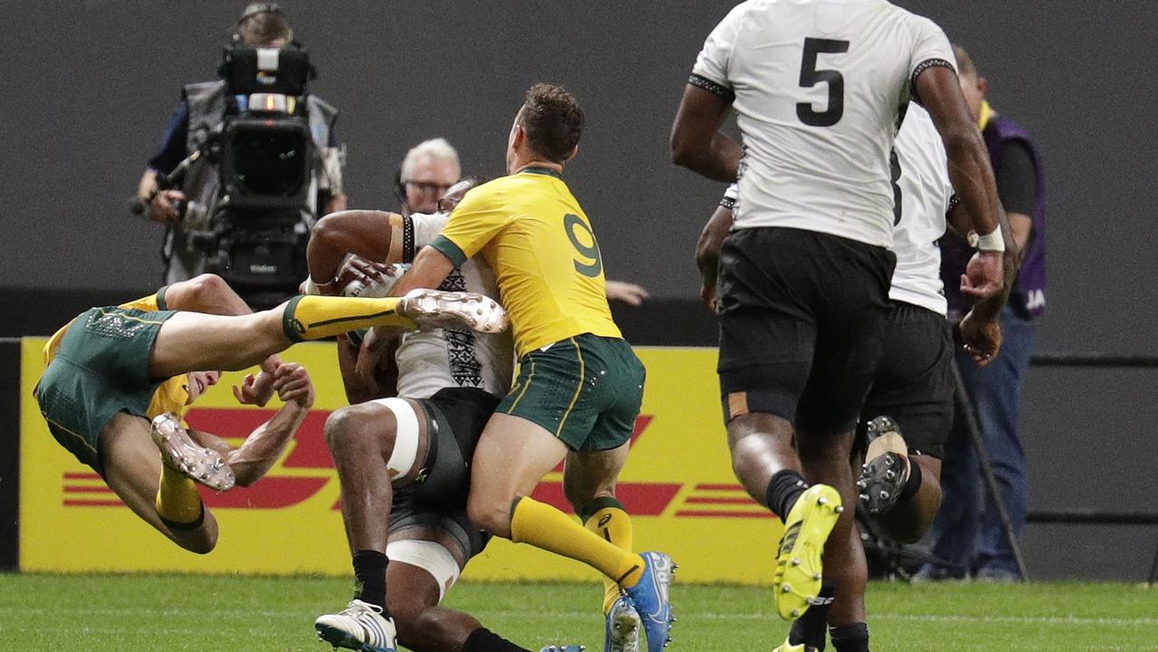 Australia's Reece Hodge, left, flies as he is pushed away by Fiji's Peceli Yato. Hodge has since been cited for the tackle.