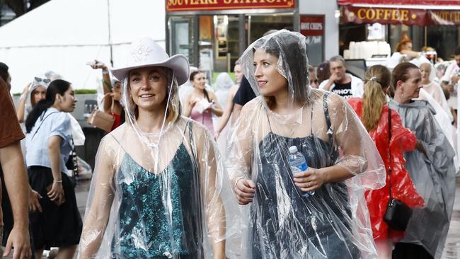 Swift fans in the rain hours before the pop sensation is due to hit the stage at Accor Stadium.