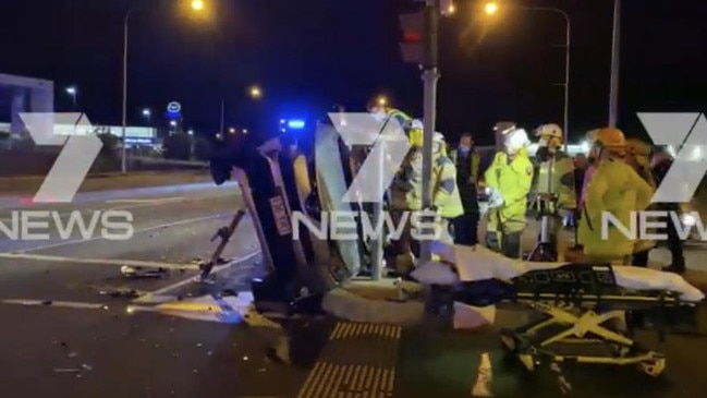 A man was lucky to escape a two-vehicle crash last night in Robina after his car rolled. Photo: Twitter: @lion_golds