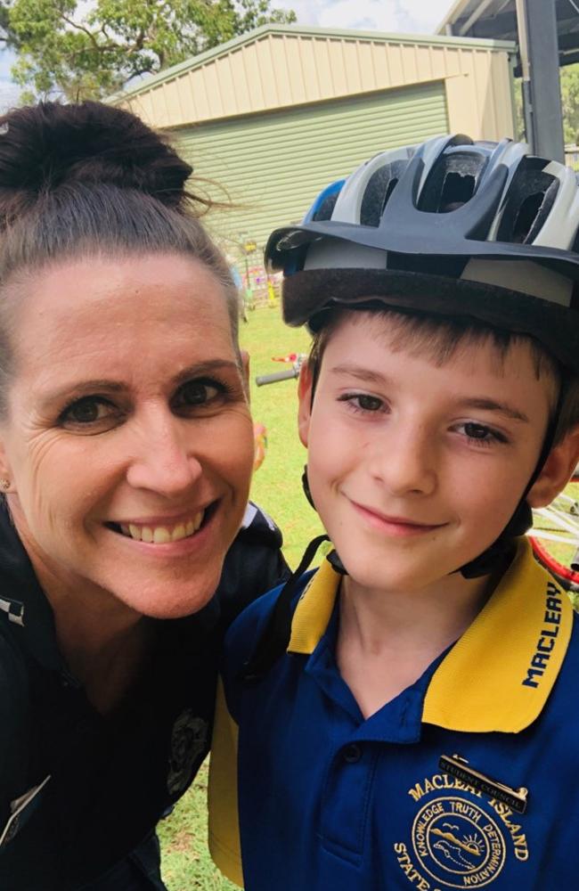 Macleay Island State School student Luke Overton with sergeant Tina Bowen