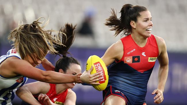 Kate Hore gets a shepherd from Daisy Pearce against the Kangaroos last season. Picture: Michael Klein