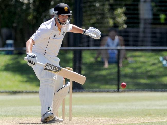 Sam Taylor watches the ball onto the bat. Picture: Andrew Henshaw