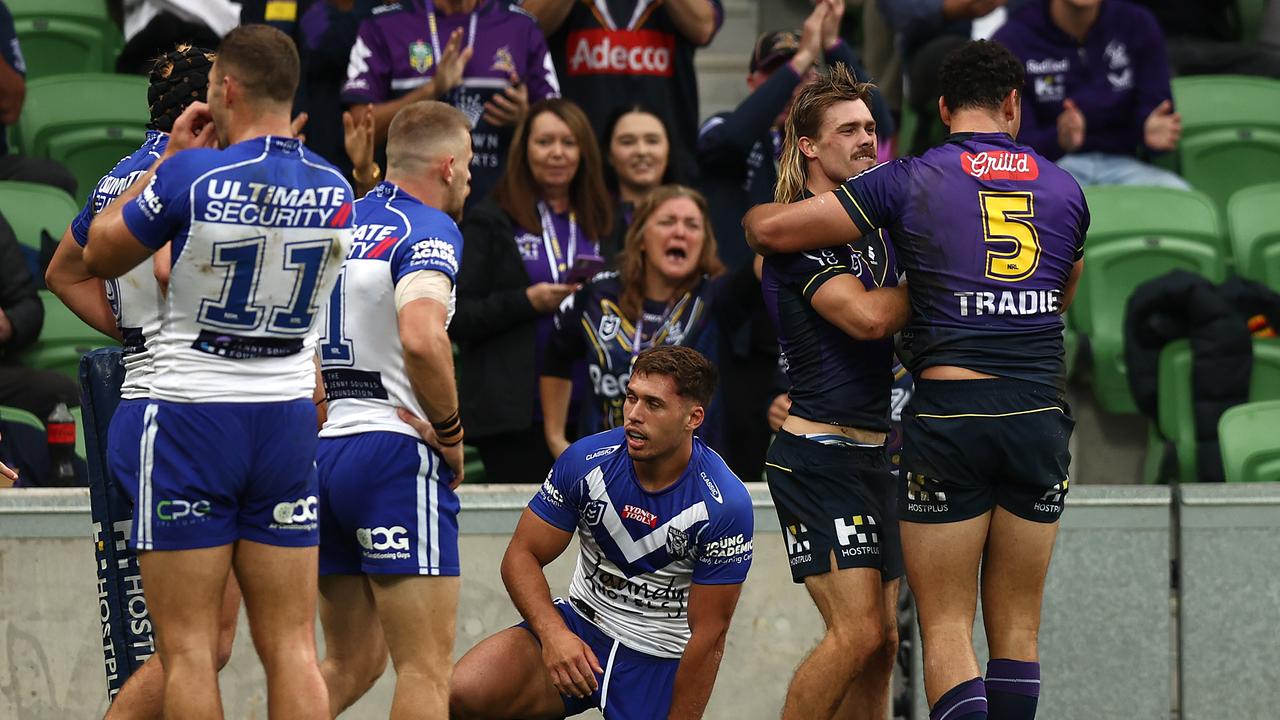 MELBOURNE, AUSTRALIA - APRIL 03: Ryan Papenhuyzen of the Storm (2R) celebrates scoring a try during the round four NRL match between the Melbourne Storm and the Canterbury Bulldogs at AAMI Park on April 03, 2022, in Melbourne, Australia. (Photo by Graham Denholm/Getty Images)